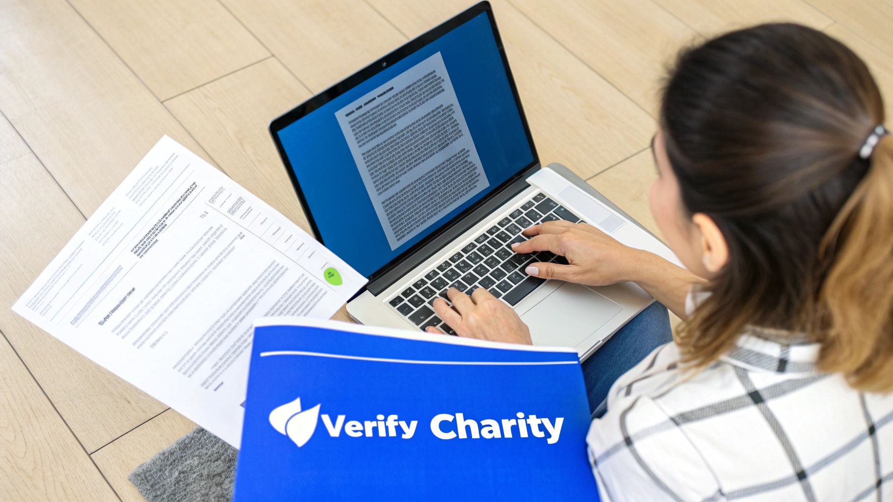 A magnifying glass held up to a document, symbolizing the process of vetting a charity.